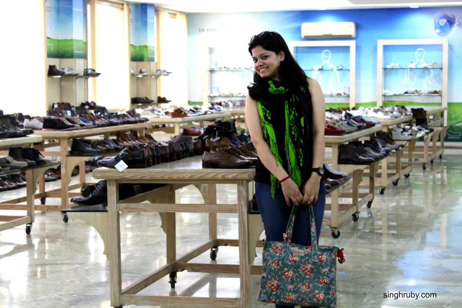 Happy to pose with the display arena. A room filled with shoes is a women's dream.